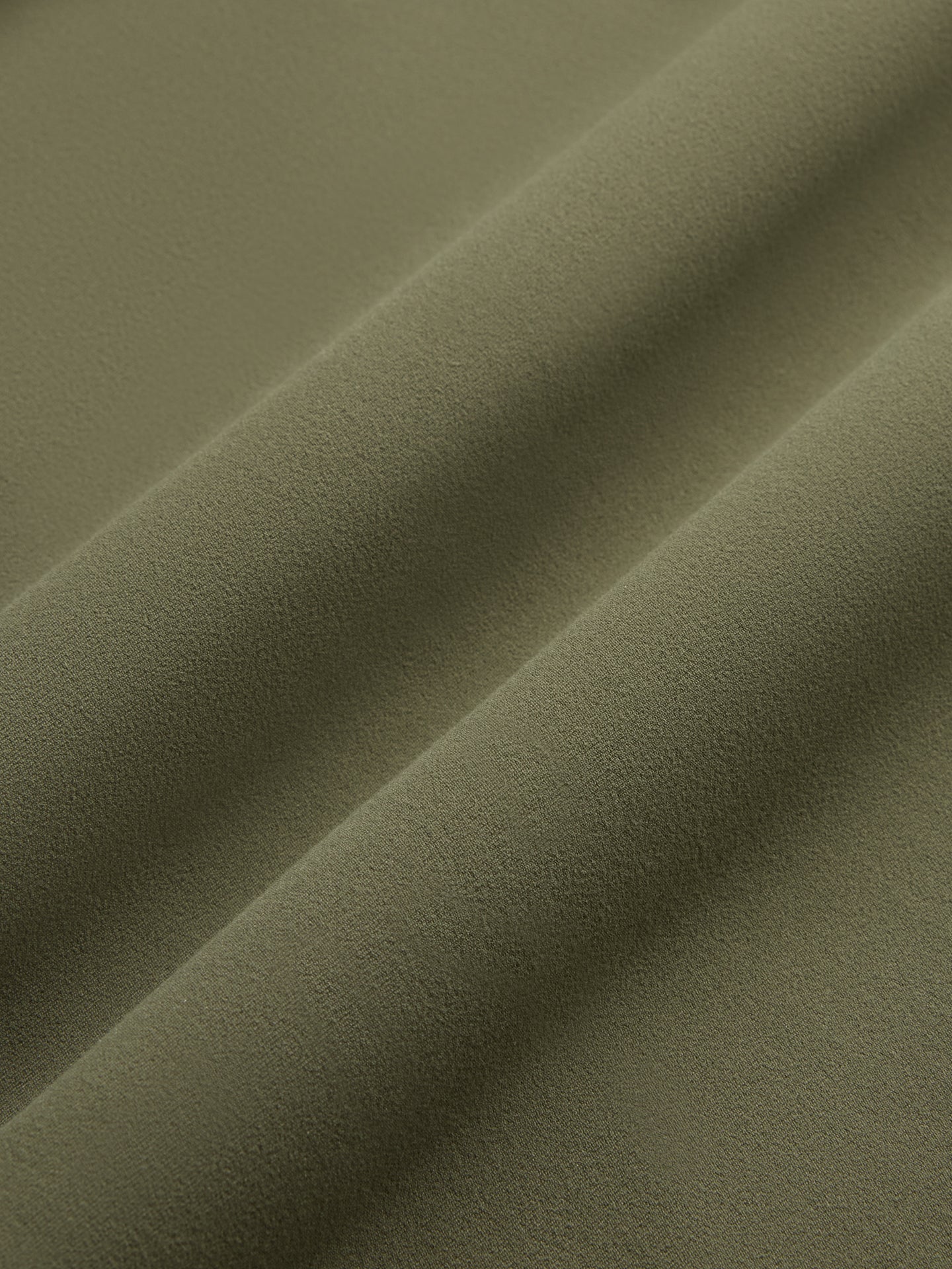 Close-up of olive Melt fabric showing smooth, soft texture.