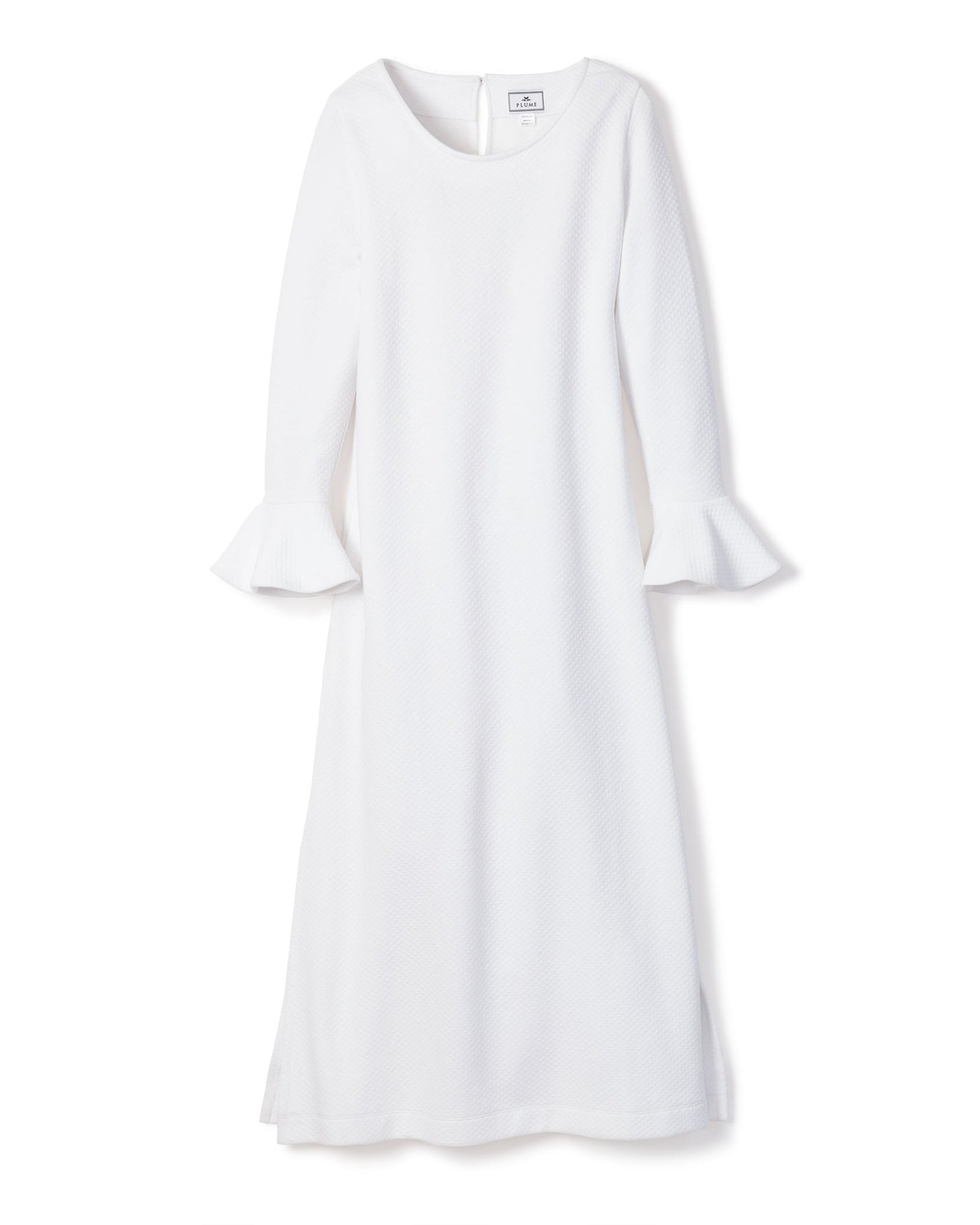 The Womens Pima Ophelia Nightgown by Petite Plume features flared cuffs, a round neckline, and a straight silhouette at midi length. Crafted from luxurious Peruvian Pima cotton, it showcases a subtle quilted effect in white jacquard against a plain white background.