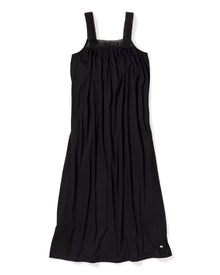 The Womens Pima Camille Nightgown by Petite Plume is a sleeveless black dress with a gathered bodice and wide shoulder straps, crafted from soft Peruvian Pima cotton. It drapes loosely with luxury nightgown vibes and has a small logo near the hem, laid flat on a white background.