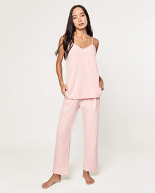 The Women's Pima Sylvie Pajama Set in Pink includes a sleeveless V-neck camisole with thin straps and matching elastic-waist pants, both accented with subtle white stitching.