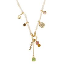 Pearl and Charm Necklace on Flat White Background