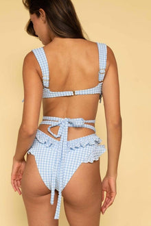 Light blue and white gingham bikini bottom with ruffled edges and tie-back closure, shown from behind.