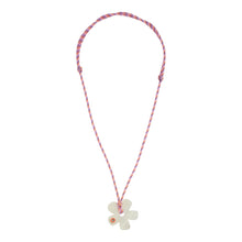 Pink Cord and White Flower Pendant Necklace on Flat White Background