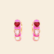 Pink Enamel and Crystal Heart Hoop Earrings on Tan Background