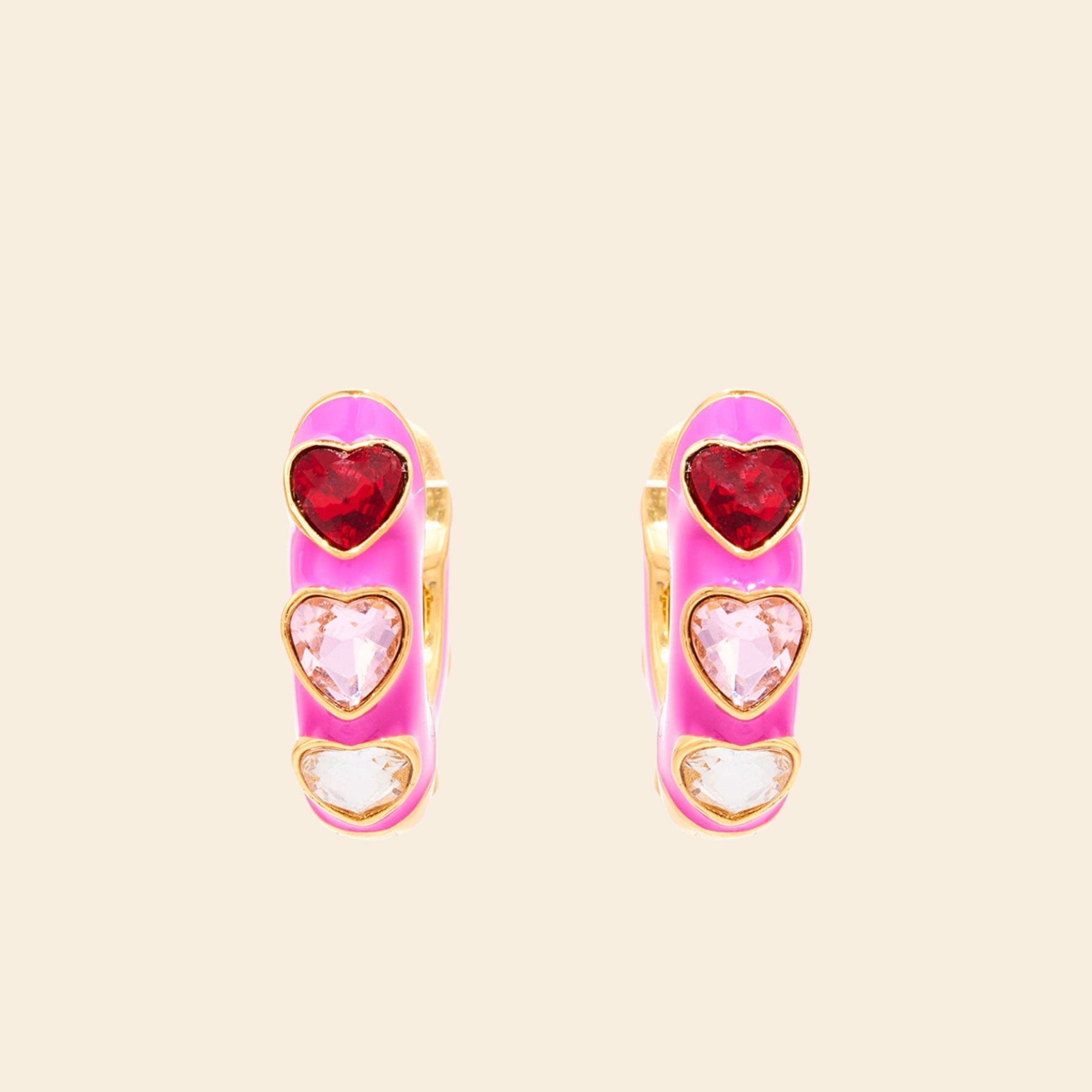 Pink Enamel and Crystal Heart Hoop Earrings on Tan Background