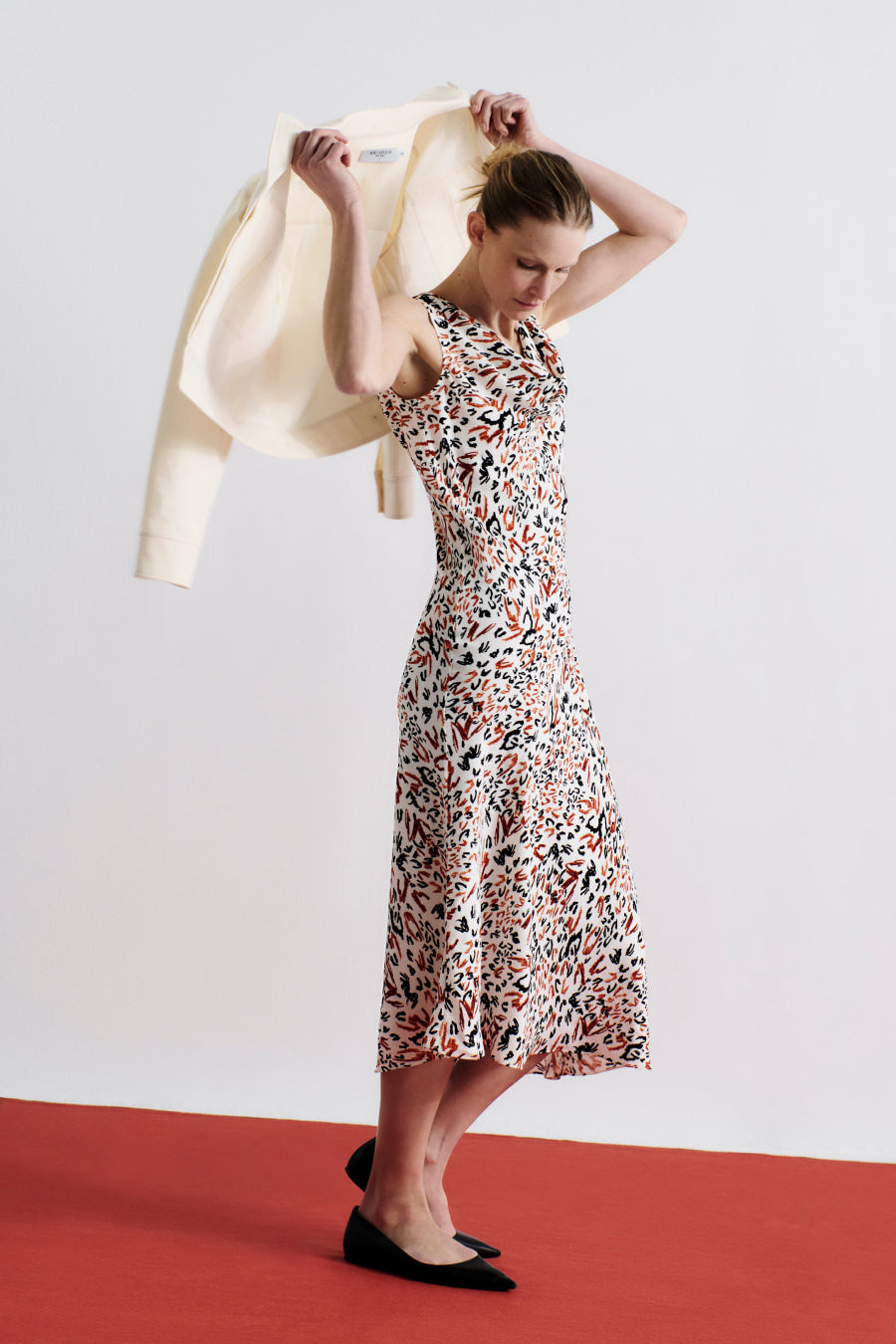 front image of a woman wearing the priya dress in leopard sketch | Exclude
