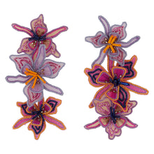 Purple and Pink Linear Drop Flower Earrings on Flat White Background
