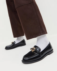 Roma Black Leather Loafer in black leather with a gold accent and Molly Workwear Jean in dark brown denim.