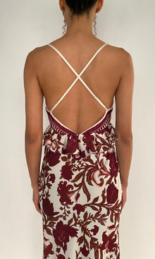 Rococo Sand | Maia Polyester Satin Lycra Cross-Back Peplum Maxi Dress | Ivory Burgundy