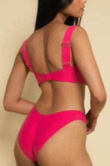 Bright pink bikini bottom with zig-zag stitching detail and full coverage back panel.