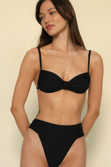 Black bikini top with sweetheart neckline, thin straps, and twisted center detail.