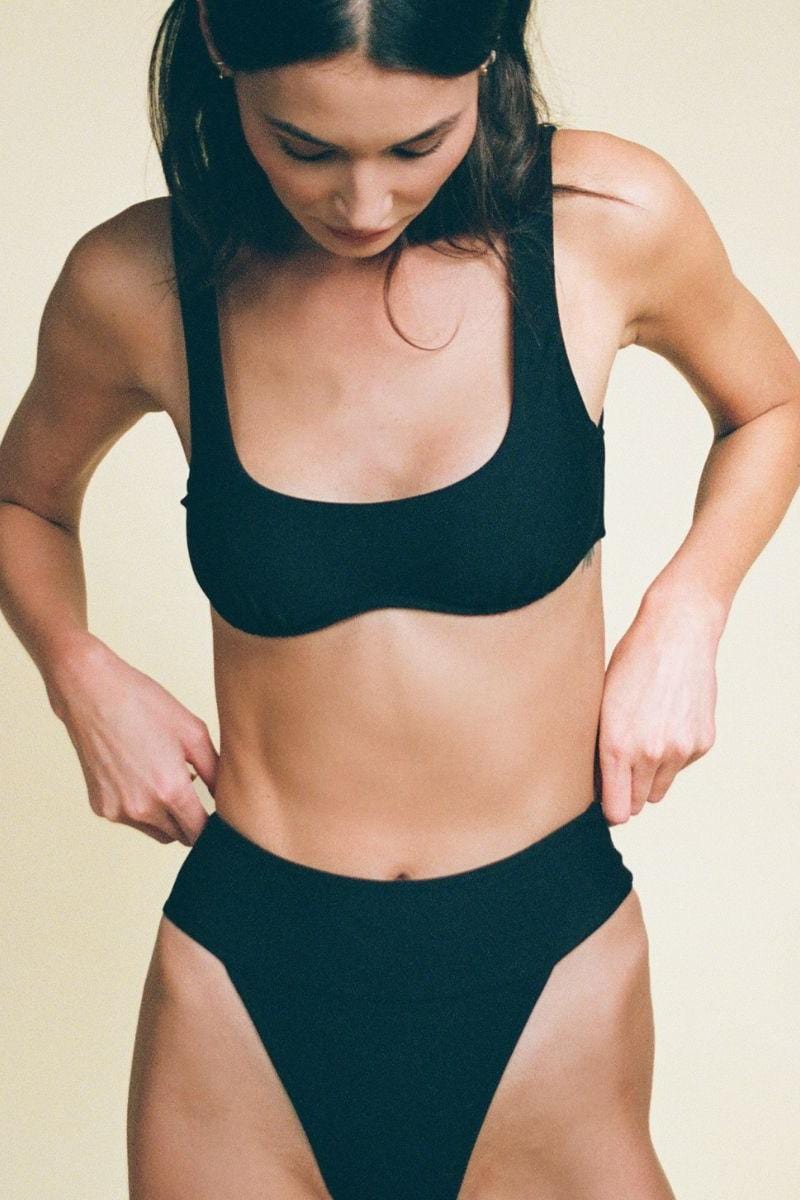 Black racerback bikini top with scoop neckline and wide shoulder straps.