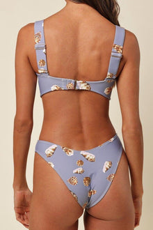 Lavender bikini bottom with gold seashell print, worn with matching bikini top, back view.