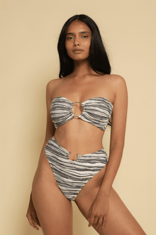 Striped bandeau bikini top with center ring detail and tie closures in black and white.
