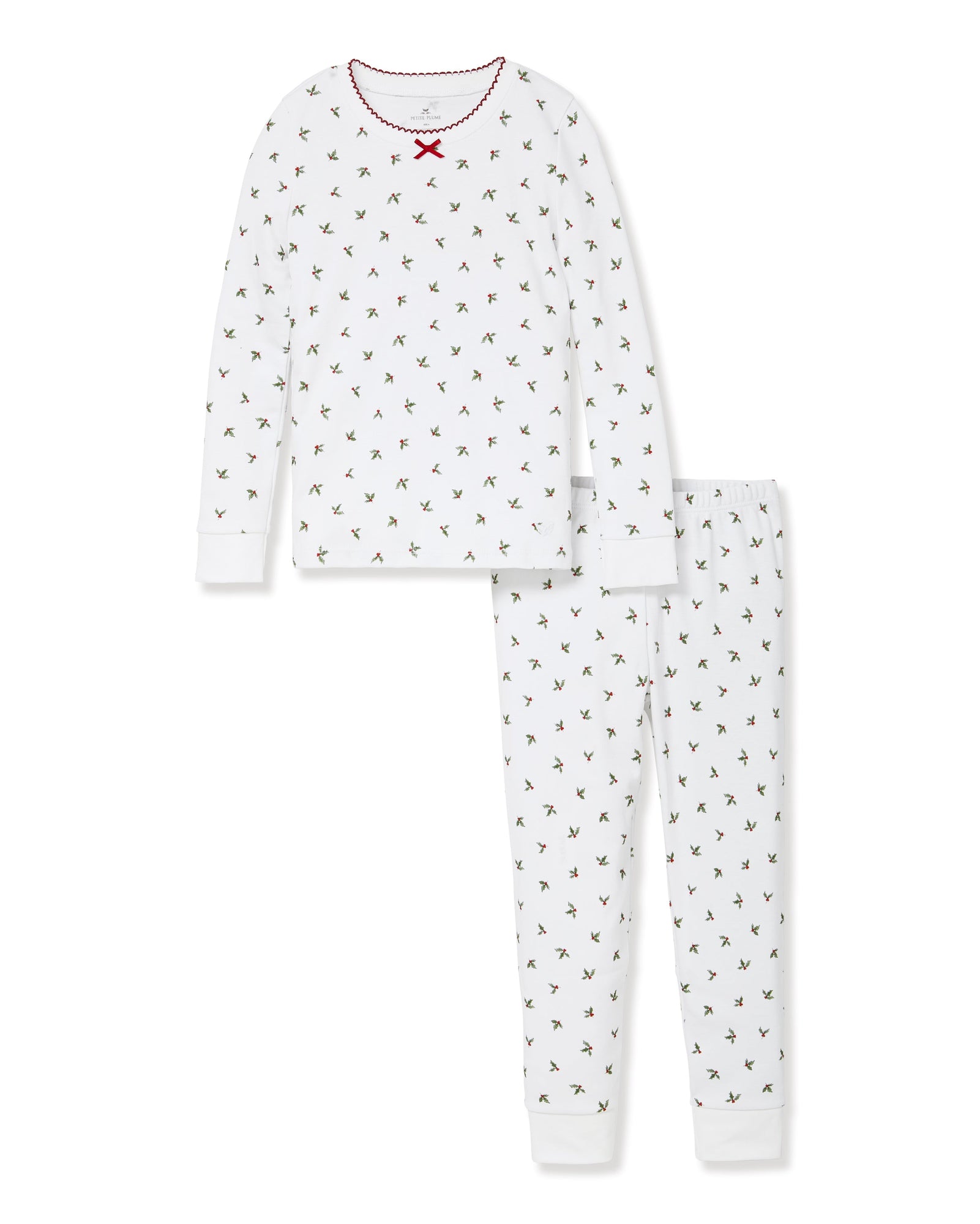 Kid's Pima Snug Fit Pajama Set in Mistletoe Moments: a two-piece white pajama set for children with a long-sleeve top, pants, green and red holly pattern, red scalloped neckline, and a red bow at the collar.