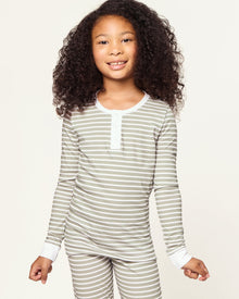 The Kid's Pima Snug Fit Pajama Set in Sage Stripe features green and white horizontal stripes, long sleeves, white cuffs at wrists and ankles, and a small button placket on the shirt. The set is displayed flat on a white background.