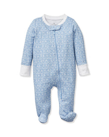 The Baby's Pima Romper in Hoppy Days Blue features a blue footed design with white cuffs, a white collar, white-outlined bunny pattern, and a diagonal zipper from neck to leg.