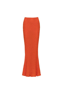 Tangerine ribbed maxi skirt with a fitted silhouette and flared hem.