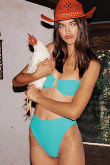 Teal bikini bottom with high-waisted cut and moderate coverage.