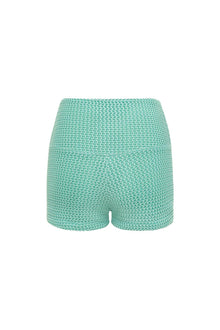 Turquoise crochet micro shorts with textured knit pattern shown from back view.