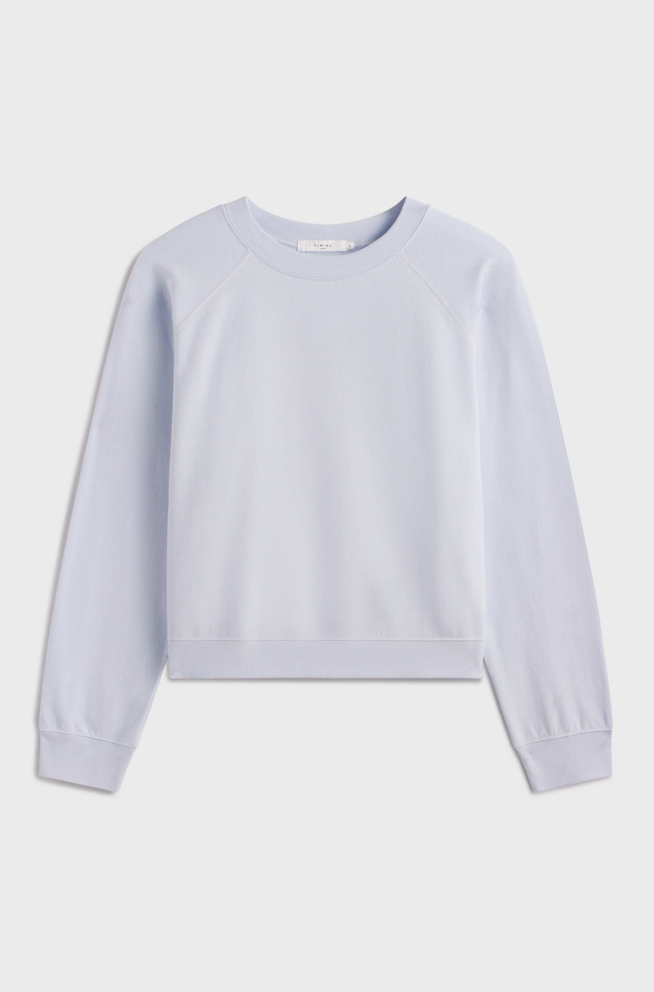 Light blue sweatshirt on a light gray background