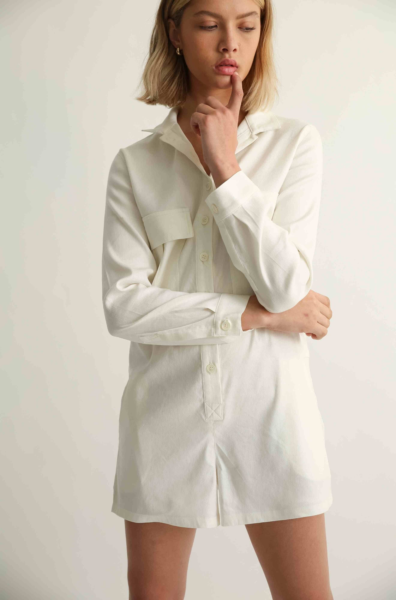 Woman wearing a white linen jumpsuit