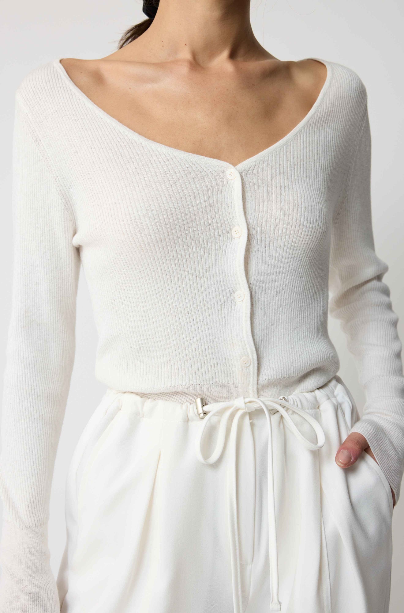 White long-sleeve top and pants worn by a person on a white background