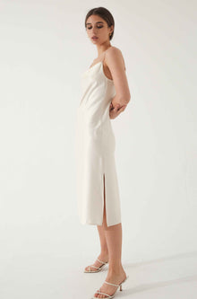 Woman wearing a white silk dress
