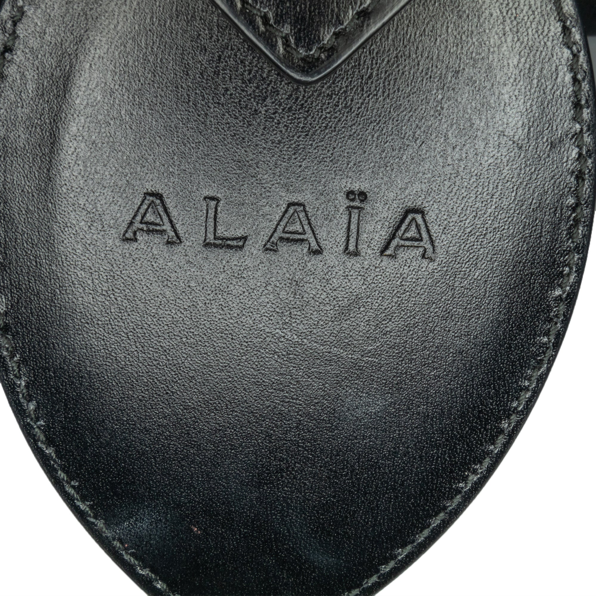 Alaïa | Pre-Owned Calfskin Eyelet Bracelet Embellished Bucket Bag | Black