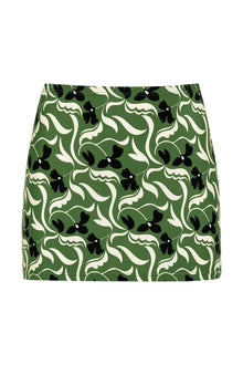 Green micro skirt with black and cream floral print throughout.