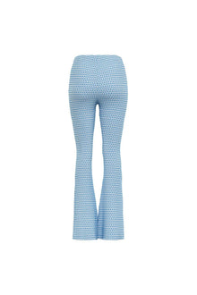 Blue and white textured flare pants with wave pattern throughout.