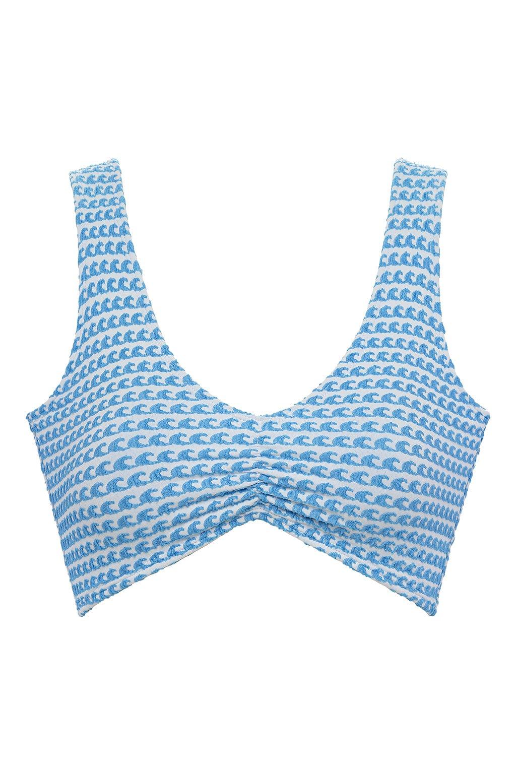 Blue and white wave print bikini top with wide shoulder straps and ruched center detail.