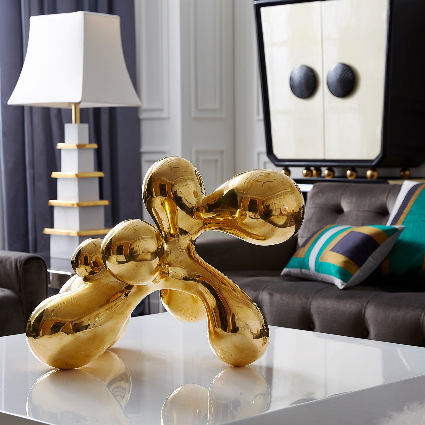 giant brass orb op art with aspen daybed