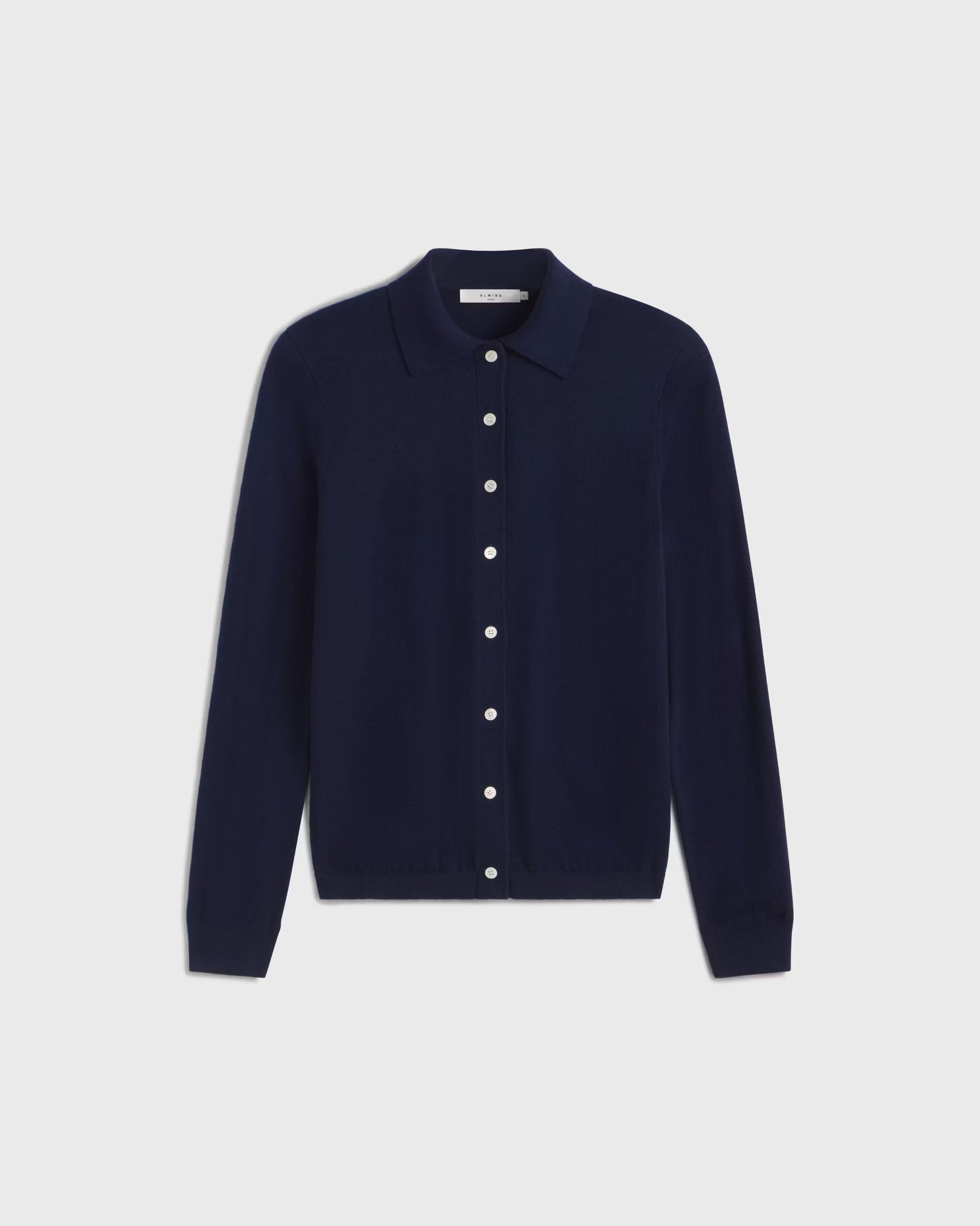Navy blue button-up shirt on a light gray background