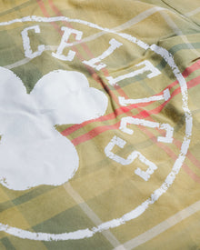 Close-up of Boston Celtics logo on heavyweight cotton twill Sports Flannel with plaid pattern