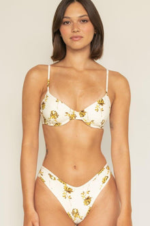 White bikini bottom with gold filigree floral pattern and high-waisted cut design.
