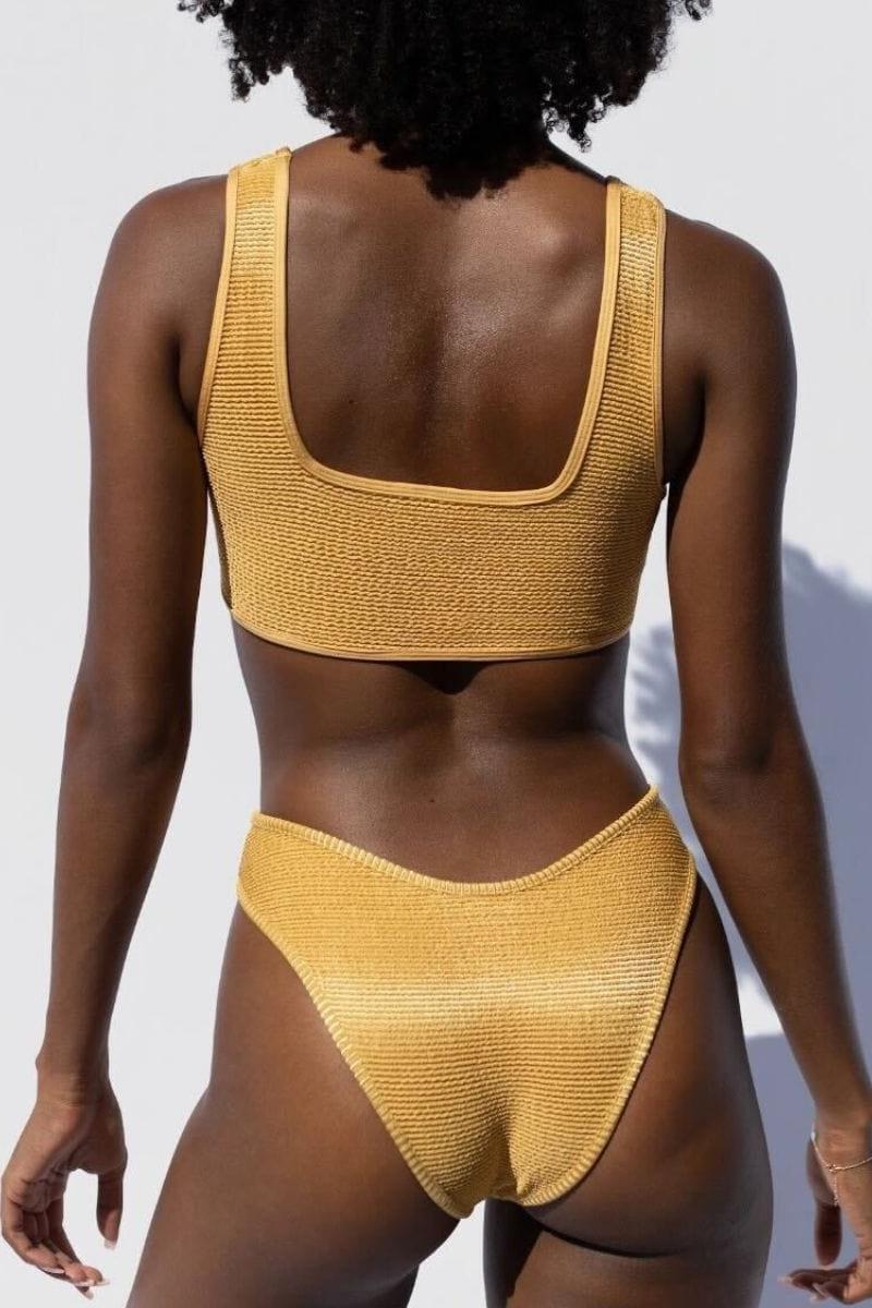 Yellow ribbed bikini bottom with high-waisted cut and curved waistband seams.