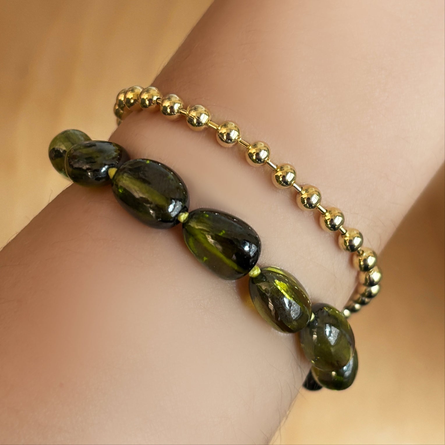green nugget bracelet with lime knots 4mm bead chain bracelet layered on the wrist.