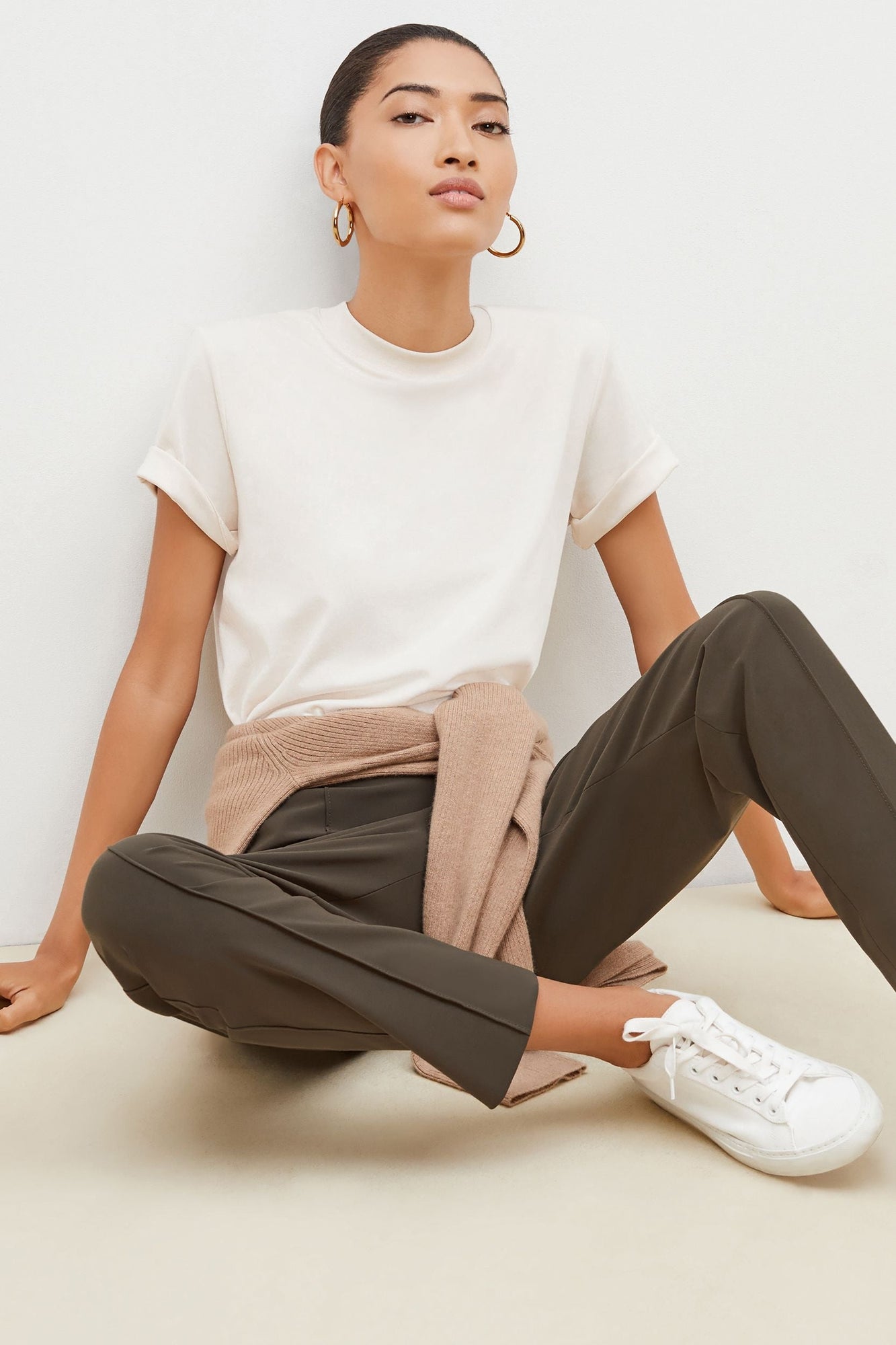 Front image of a woman standing wearing the leslie top in compact cotton in ivory | Grid | Exclude