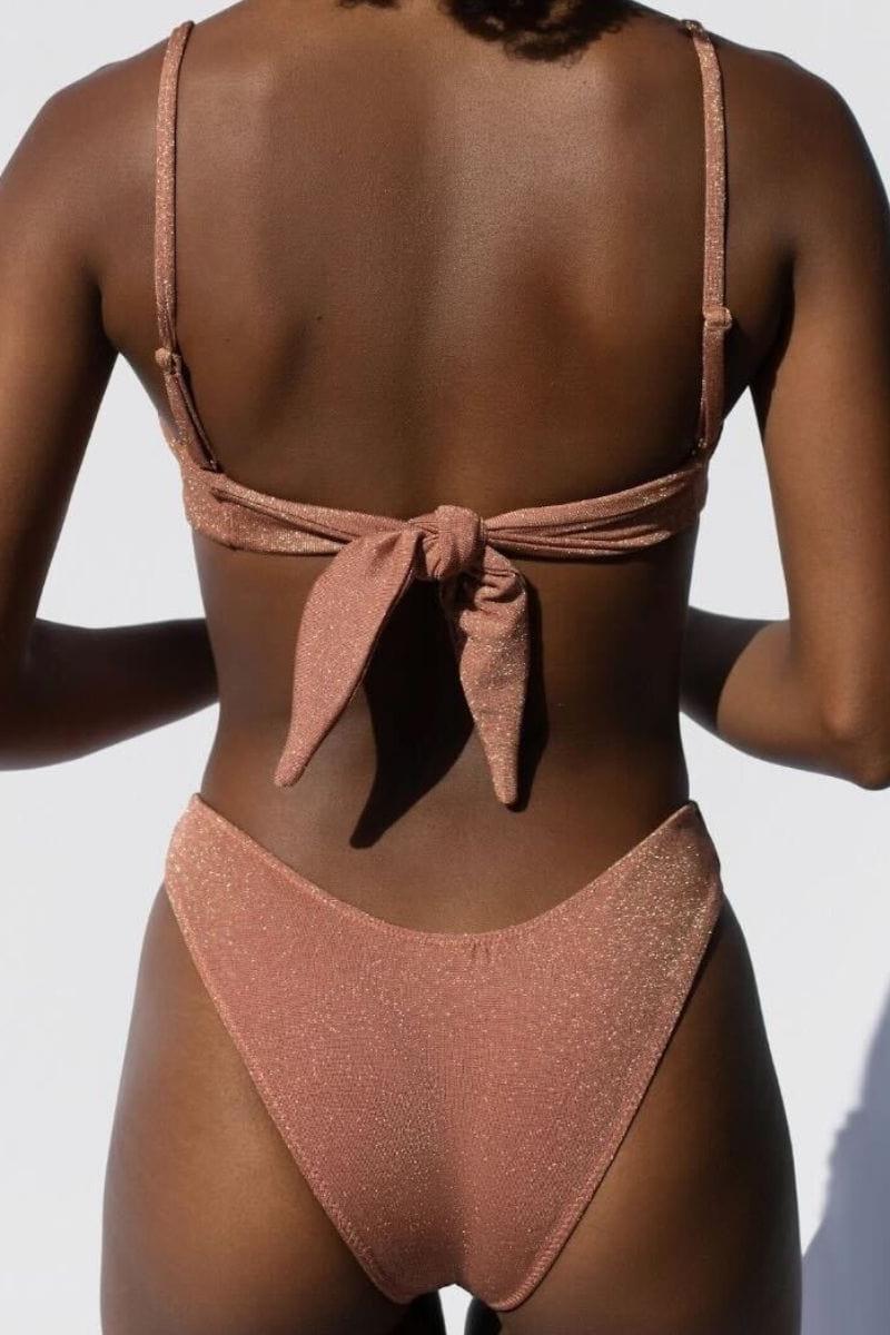 Mauve sparkle bandeau bikini top with tie-back closure shown from rear view.