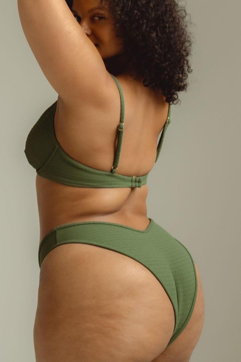 Olive green ribbed bikini bottom with scrunched sides and zig-zag stitching detail.