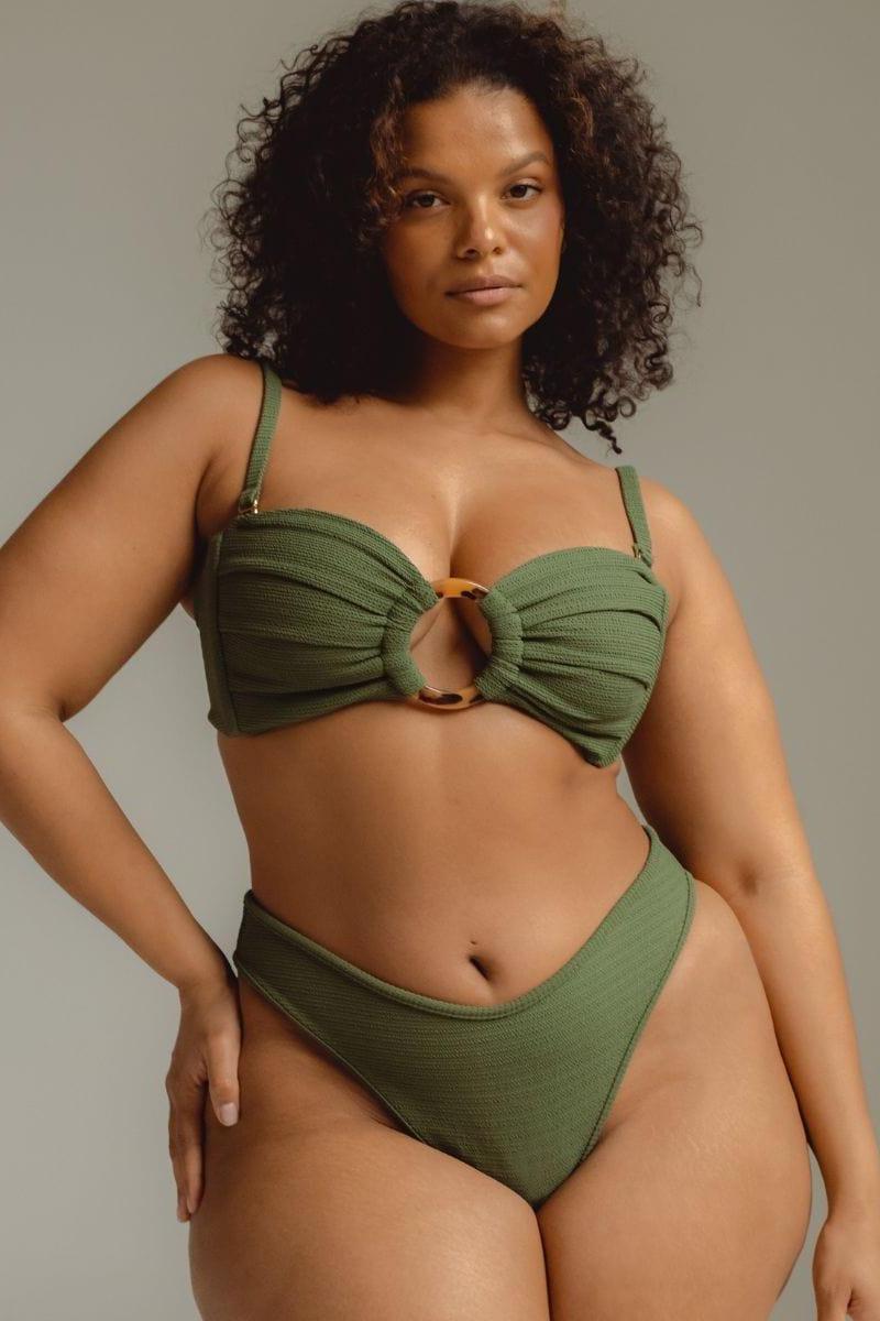Olive green bandeau bikini top with ruched fabric and gold ring detail at center front.