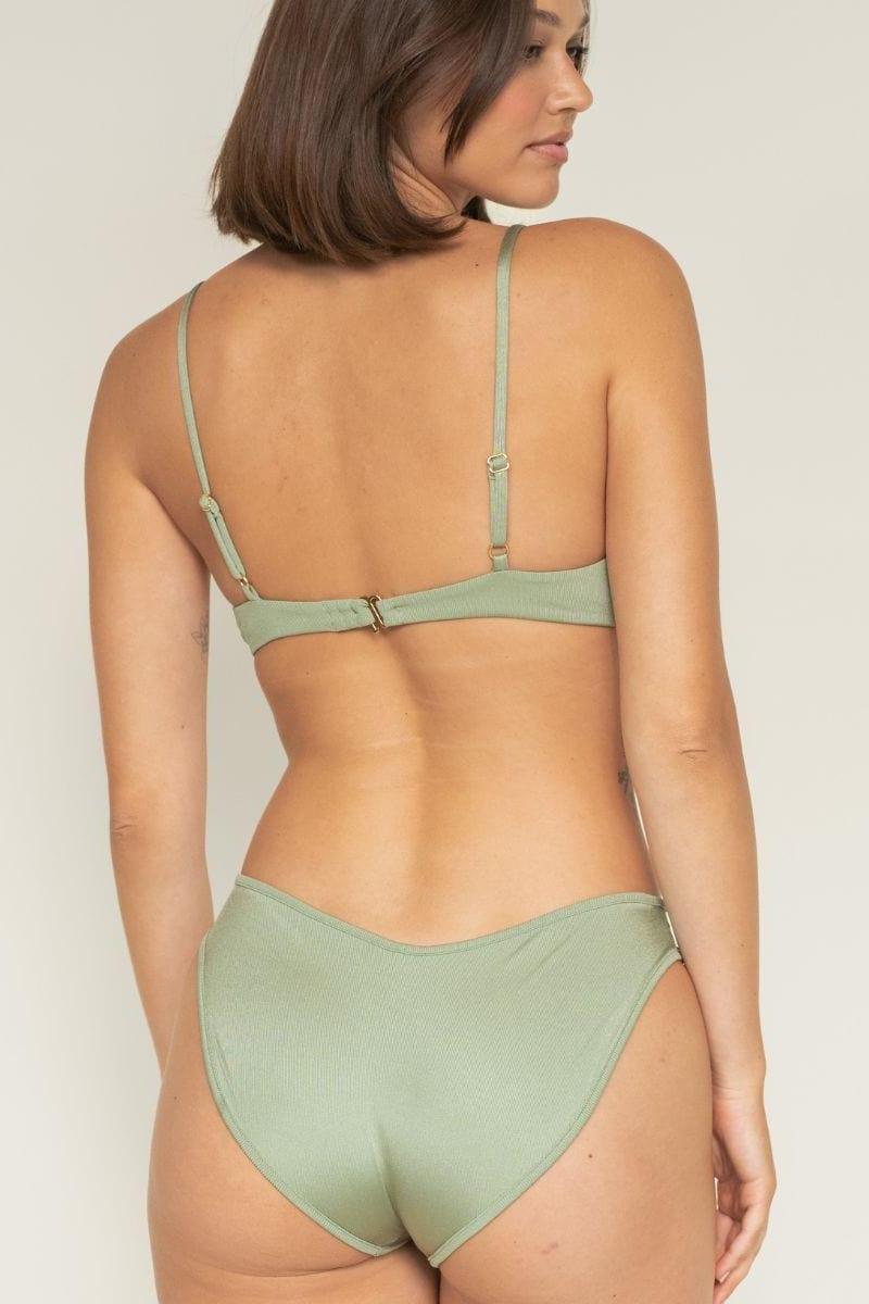 Sage green ribbed bikini bottom with moderate coverage, shown from back on model wearing matching top.