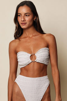 White textured bandeau bikini top with center ring detail and tie closures.