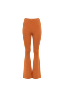 Burnt orange flare pants with a sparkly textured fabric and high waistband.