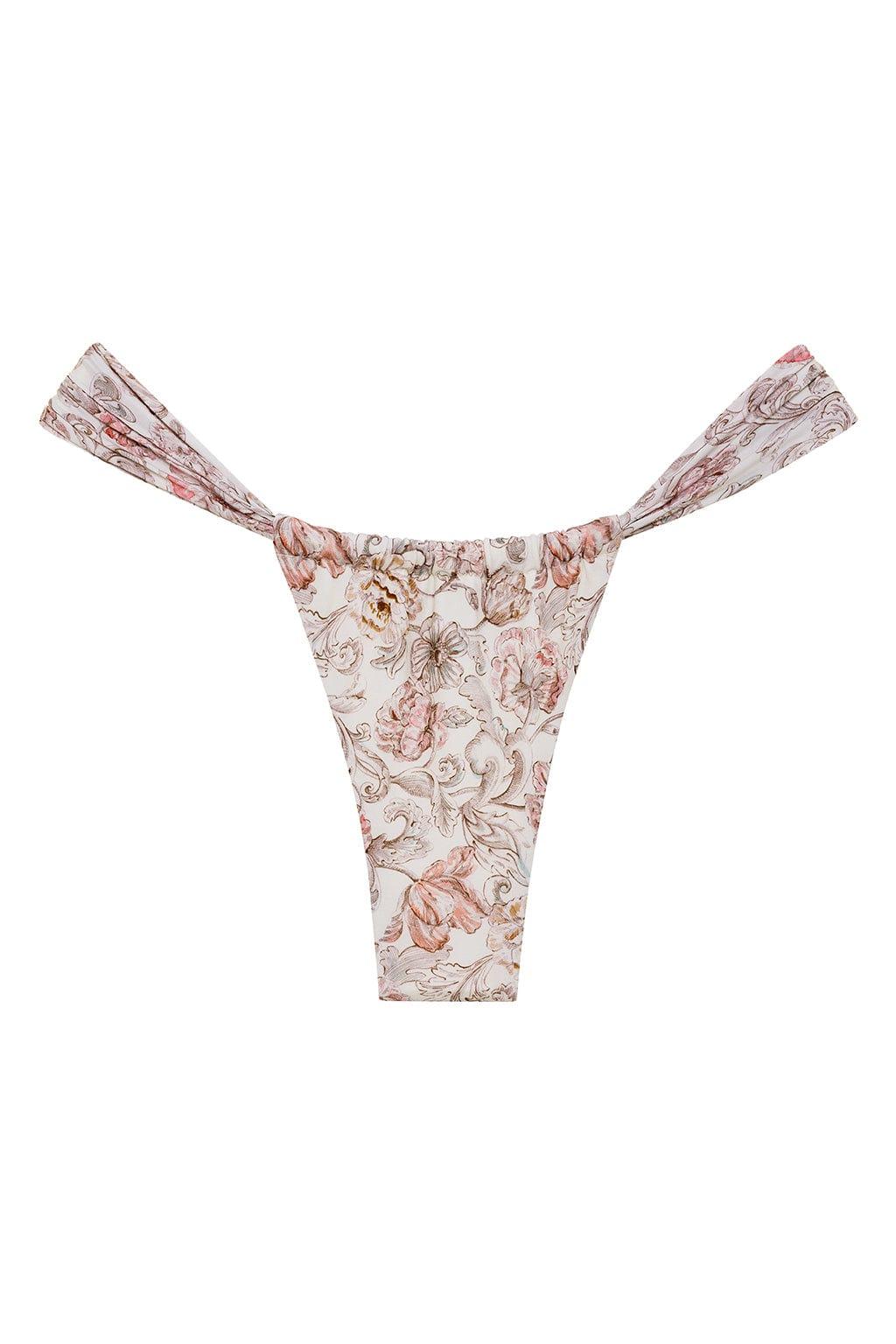 Cream bikini bottom with rose and brown floral print, featuring ruched side details and thin straps.