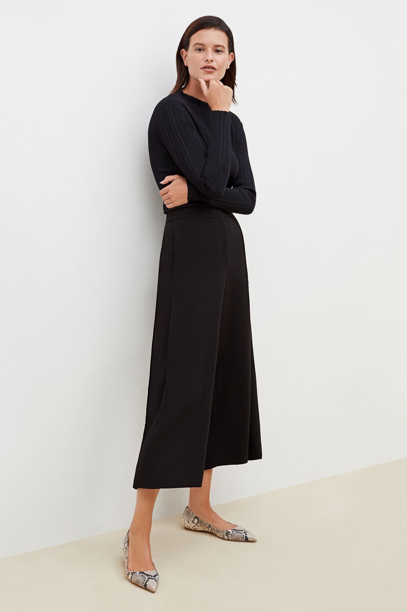Image of a woman wearing the Zhou Culotte - Eco Soft Wave :: Black | Exclude