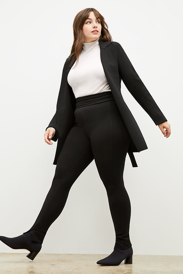 Front image of a woman standing wearing the stella legging in black | Exclude